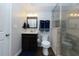 Finished bathroom featuring a glass-enclosed shower and modern fixtures throughout at 225 Sundance Dr, Woodstock, GA 30188