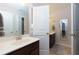 Bright bathroom with double sinks and a shared space featuring a tub and shower at 225 Sundance Dr, Woodstock, GA 30188