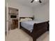 Comfortable bedroom with a simple bed and doorway to another room featuring a pool table, perfect for relaxation at 225 Sundance Dr, Woodstock, GA 30188