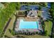 Aerial view of the community pool and clubhouse, featuring ample seating and well-manicured landscaping at 225 Sundance Dr, Woodstock, GA 30188