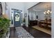 Bright foyer with blue front door and view into dining room at 225 Sundance Dr, Woodstock, GA 30188