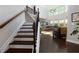 Elegant foyer with hardwood floors, staircase, and abundant natural light at 225 Sundance Dr, Woodstock, GA 30188