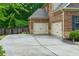 Attached two-car garage with convenient driveway access at 225 Sundance Dr, Woodstock, GA 30188