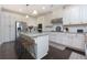 Modern kitchen with an island, granite countertops, and ample cabinet space at 225 Sundance Dr, Woodstock, GA 30188