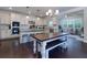 Spacious kitchen with an island, stainless steel appliances, and a dining table at 225 Sundance Dr, Woodstock, GA 30188
