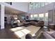 Bright living room with a soaring ceiling, large windows, and hardwood floors at 225 Sundance Dr, Woodstock, GA 30188