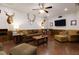 Cozy living room with leather seating, wood accents, and a large flat screen TV, ideal for relaxation at 225 Sundance Dr, Woodstock, GA 30188