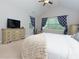 Light and bright main bedroom with lots of windows and ceiling fan at 225 Sundance Dr, Woodstock, GA 30188