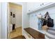 Functional mudroom with built-in bench, storage, and convenient access to the garage at 225 Sundance Dr, Woodstock, GA 30188