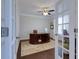 Bright office with glass doors, hardwood floors, and a large wooden desk at 225 Sundance Dr, Woodstock, GA 30188