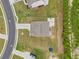 Aerial view of a well-maintained property showcasing the roof, driveway, and surrounding landscape at 2889 Windsor Knoll Dr, Dacula, GA 30019