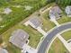 Aerial view showcases a property with a backyard trampoline amidst other homes in a neighborhood at 2889 Windsor Knoll Dr, Dacula, GA 30019