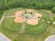 Aerial view of multiple well-kept baseball fields in a park with trees and ample parking at 2889 Windsor Knoll Dr, Dacula, GA 30019