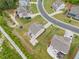 Aerial view showcasing a landscaped property with a backyard trampoline, located in a suburban neighborhood at 2889 Windsor Knoll Dr, Dacula, GA 30019