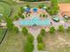 Aerial view of a community park featuring playground, baseball field, and picnic area at 2889 Windsor Knoll Dr, Dacula, GA 30019