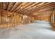 Unfinished basement featuring exposed beams and concrete floor, offering a blank canvas for customization and expansion at 2889 Windsor Knoll Dr, Dacula, GA 30019