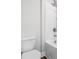 This bathroom features a modern tub and shower, a white toilet and shiny hardware at 2889 Windsor Knoll Dr, Dacula, GA 30019