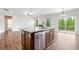Open-concept kitchen featuring granite countertops and stainless steel dishwasher at 2889 Windsor Knoll Dr, Dacula, GA 30019