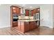Gourmet kitchen with granite island, stainless steel appliances, and custom cabinetry at 2889 Windsor Knoll Dr, Dacula, GA 30019
