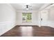 Bright living room with crown molding, wainscoting and hardwood floors at 2889 Windsor Knoll Dr, Dacula, GA 30019