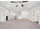 A spacious loft with neutral carpet, multiple doorways, and recessed lighting offers versatility at 2889 Windsor Knoll Dr, Dacula, GA 30019