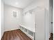 Mudroom with built-in shelving, coat hooks, and a bench, offering practical storage and organization at 2889 Windsor Knoll Dr, Dacula, GA 30019