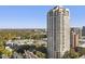 Stunning aerial view of a high-rise apartment building and its lush surroundings at 3475 Oak Valley Ne Rd # 950, Atlanta, GA 30326