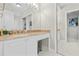 Bright bathroom with granite countertop, a vanity, and large mirror in neutral tones at 3475 Oak Valley Ne Rd # 950, Atlanta, GA 30326