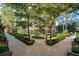 Beautifully landscaped courtyard featuring trimmed bushes, sidewalks, and mature trees at 3475 Oak Valley Ne Rd # 950, Atlanta, GA 30326