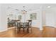 Well lit Dining room with elegant chandelier and hardwood floors at 3475 Oak Valley Ne Rd # 950, Atlanta, GA 30326