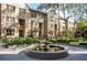 Exterior of townhomes featuring a decorative water fountain and lush landscaping at 3475 Oak Valley Ne Rd # 950, Atlanta, GA 30326