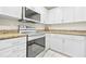 Updated kitchen with white cabinets, granite countertops and stainless appliances at 3475 Oak Valley Ne Rd # 950, Atlanta, GA 30326