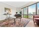 Living room featuring hardwood floors, a wall of windows and comfortable seating at 3475 Oak Valley Ne Rd # 950, Atlanta, GA 30326