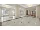 Elegant lobby with sleek, marbled floors, soaring pillars, and modern light fixtures at 3475 Oak Valley Ne Rd # 950, Atlanta, GA 30326