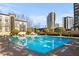 Inviting outdoor pool surrounded by lush landscaping and city views at 3475 Oak Valley Ne Rd # 950, Atlanta, GA 30326