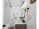 Beautiful bathroom featuring modern vanity, gold mirror, and elegant fixtures, with tiled shower at 1477 Spruce Se Dr, Smyrna, GA 30080