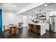 Modern kitchen featuring stainless steel appliances, a center island, and sleek white cabinetry at 1477 Spruce Se Dr, Smyrna, GA 30080
