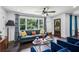 Cozy living room features comfortable seating, large windows, and stylish decor at 1477 Spruce Se Dr, Smyrna, GA 30080