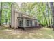 Angled exterior view of home with back porch, siding and lush backyard at 205 N Fayette Dr, Fayetteville, GA 30214