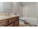 Bathroom with vanity, tile flooring, shower-tub combination, and standard white toilet at 205 N Fayette Dr, Fayetteville, GA 30214