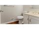 Bathroom featuring a toilet and vanity sink with storage, and neutral wall paint at 205 N Fayette Dr, Fayetteville, GA 30214