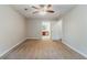 Empty bedroom with neutral carpet, ceiling fan, and doorway to the ensuite bathroom at 205 N Fayette Dr, Fayetteville, GA 30214