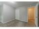 Unfurnished bedroom with a doorway to a walk-in closet and neutral-colored walls at 205 N Fayette Dr, Fayetteville, GA 30214