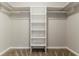 Empty walk-in closet featuring carpeted floors and built-in shelving units at 205 N Fayette Dr, Fayetteville, GA 30214