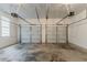 Spacious two-car garage featuring concrete floor and two automatic doors at 205 N Fayette Dr, Fayetteville, GA 30214