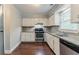 Kitchen featuring white cabinets, stainless steel appliances, and granite countertops at 205 N Fayette Dr, Fayetteville, GA 30214