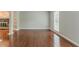 Spacious living room with hardwood flooring, fireplace, built in shelves, and natural light at 205 N Fayette Dr, Fayetteville, GA 30214
