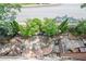 Charming backyard featuring a brick patio, lush trees, and a well-manicured yard at 2295 Falmouth Se Ct, Smyrna, GA 30080