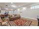 Finished basement with wood floors, decorative rug, and comfortable seating at 2295 Falmouth Se Ct, Smyrna, GA 30080