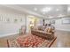 Spacious finished basement featuring a sitting area with decorative rug and recessed lighting at 2295 Falmouth Se Ct, Smyrna, GA 30080